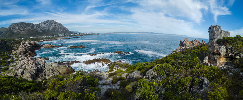 View of the beautiful rocky coastline Walker Bay and Kleinrivier Mountains from the Cliff Path at Sievers Point. Hermanus Whale Coast Overberg Western Cape. South Africa